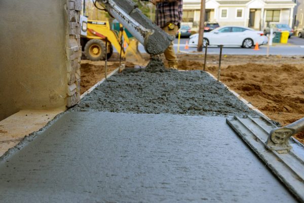 construction-worker-pouring-reinforced-concrete-ce-2025-03-27-05-46-50-utc-scaled.jpg